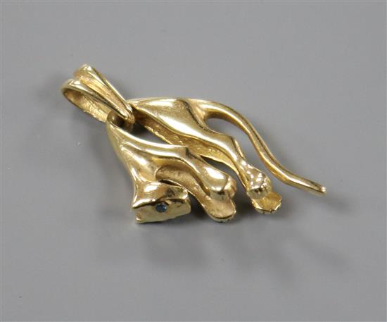 A modern 585 yellow metal and gem set stylised panther pendant, 30mm.